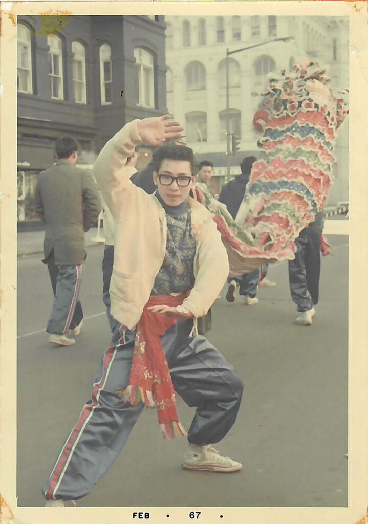 Martial artist Hoy K. Lee strikes a pose with the Chinese Youth Club’s lion dance team.