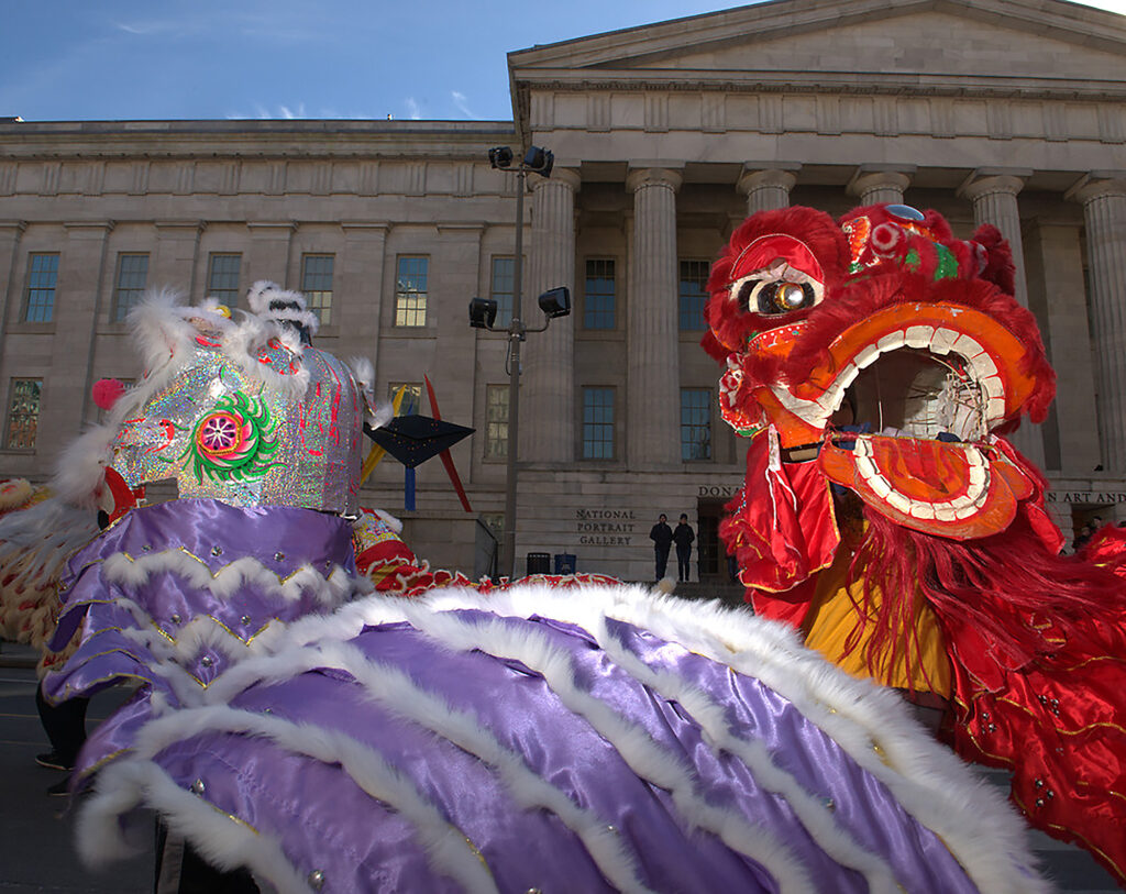 Lion Dancers perform in front of the Smithsonian American Art Museum & National Portrait Gallery